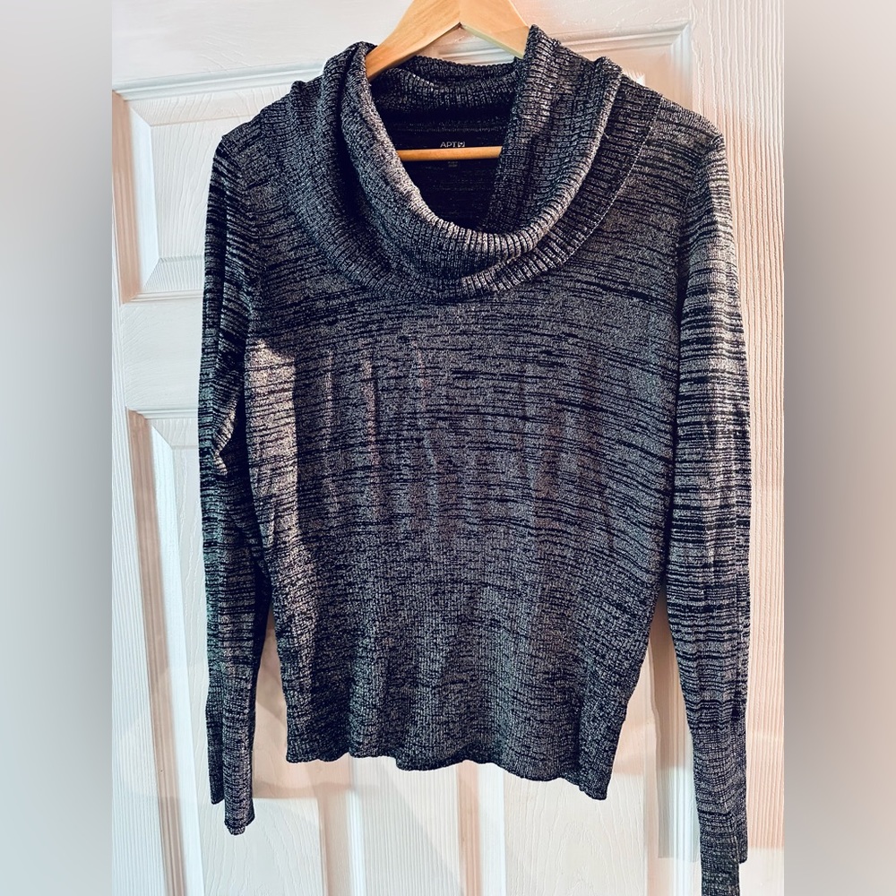 Black and silvery sweater. Cowl like neck. Fitted lower arms and waist. Size L